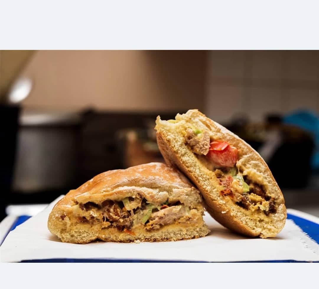 A freshly prepared filled roll cut in half
